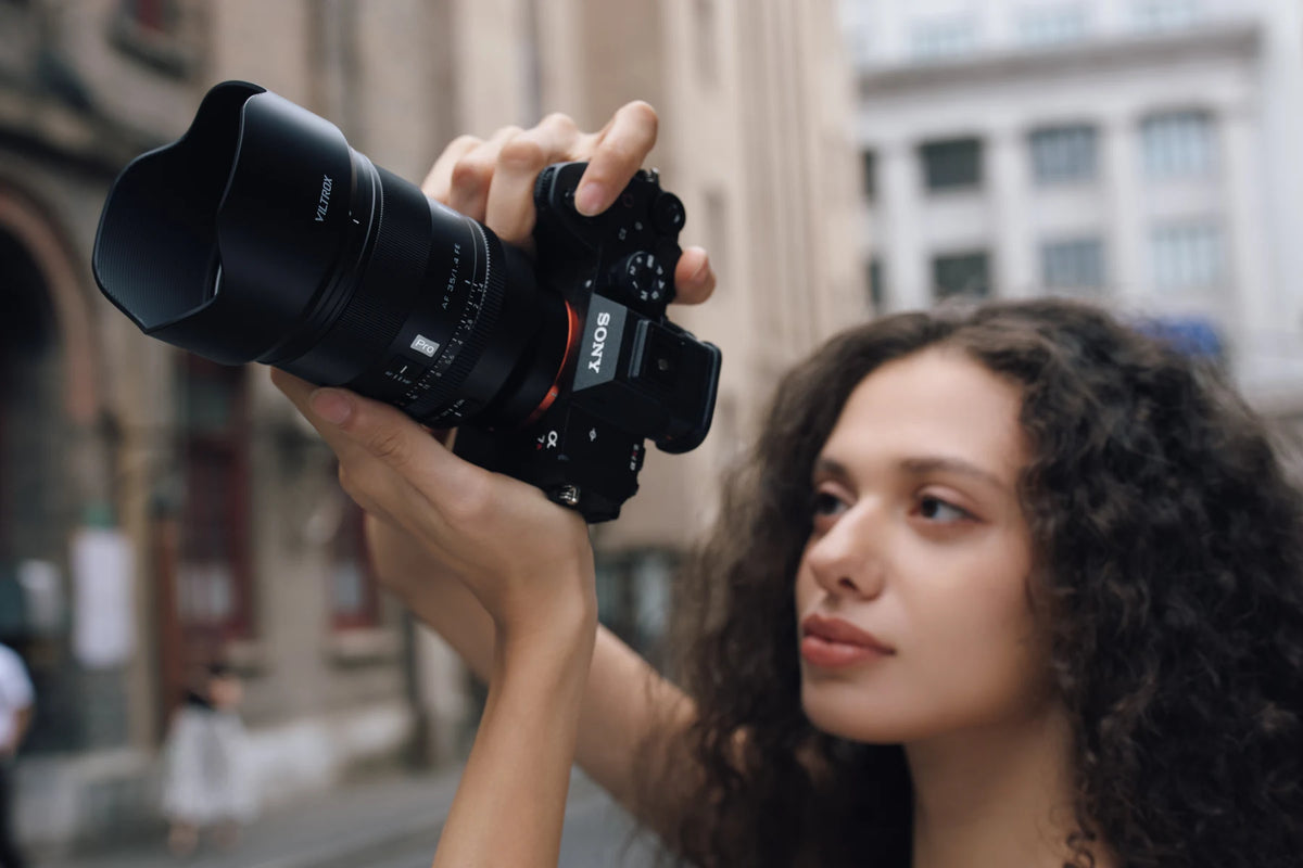 Photographer using the Viltrox AF 35mm F1.4 Pro FE on a Sony camera